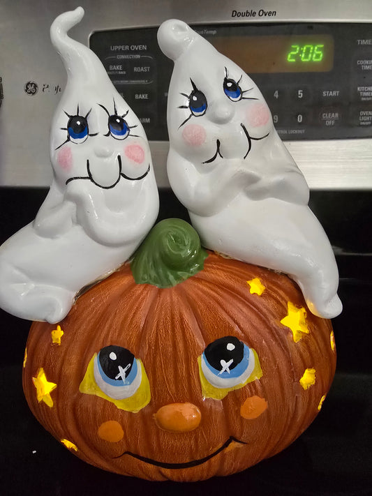 Ghosts sitting on Pumpkin
