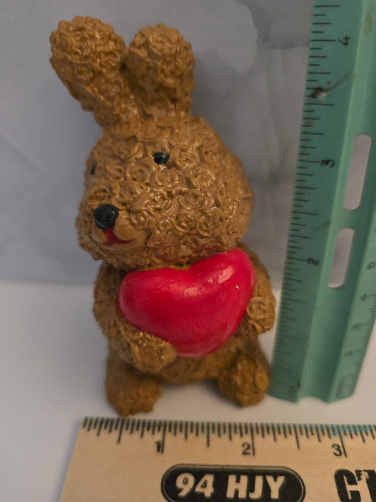 Small Bunny holding a heart