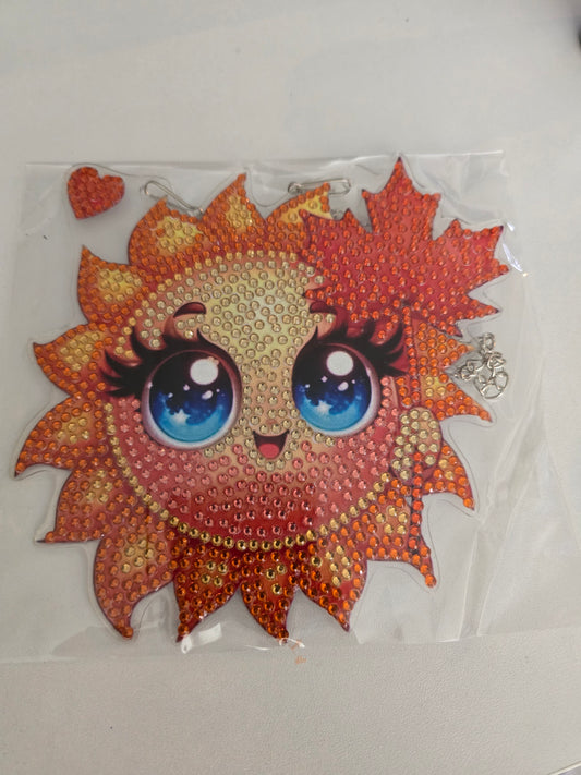 Sun wall hanging with face and leaves